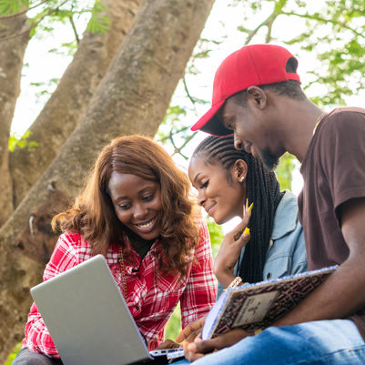 Students working together outside on campus