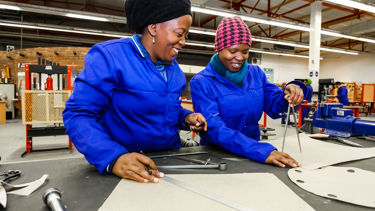 Women working together, focusing on skills Women working together, focusing on skills