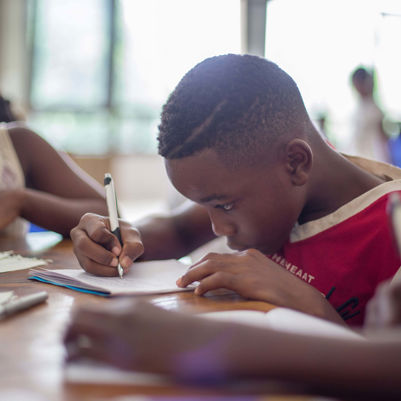 Boy working focused in class - credits Santi Vedri