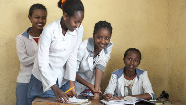 Girls in class, doing homework